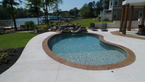 a curved, custom vinyl pool installed by Kirk's Pool and Hearth